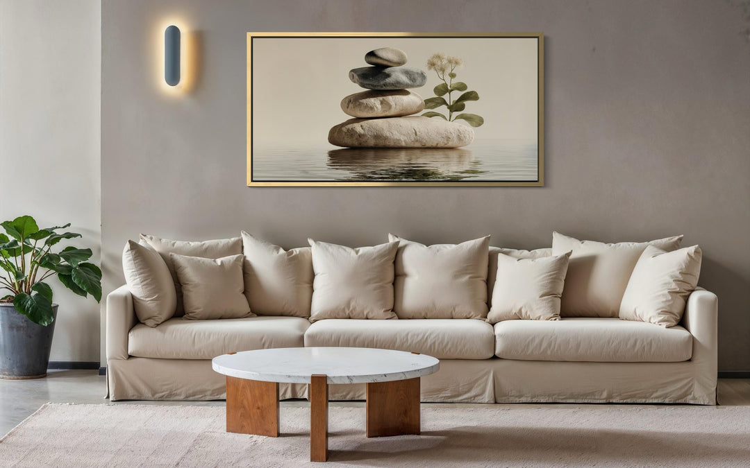Zen stacked stones horizontal wall art in a warm, minimalist living room setting.