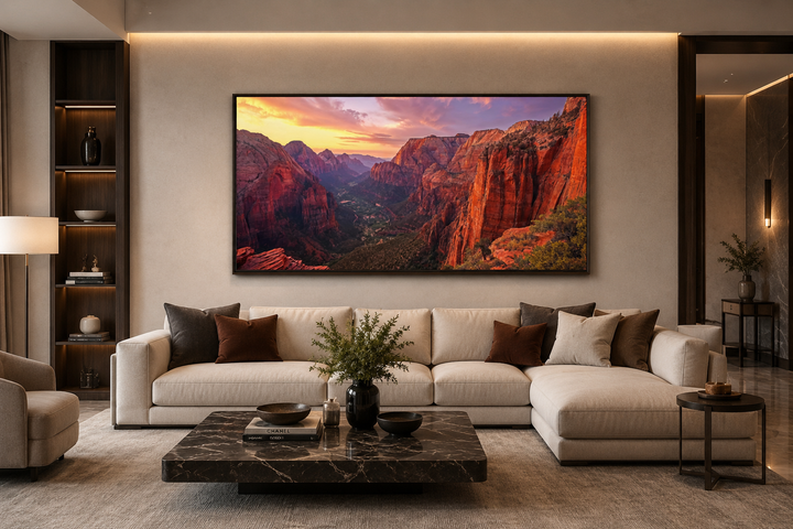 Framed canvas wall art of a Zion National Park sunset over a modern living room sofa.