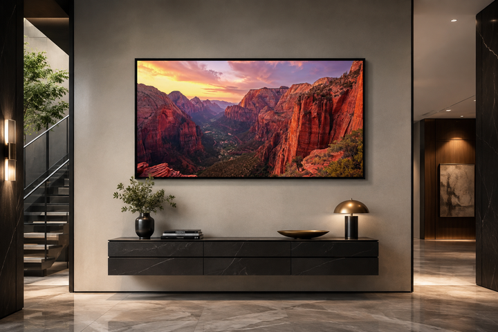 Framed canvas wall art of a Zion National Park sunset over a modern black floating console.