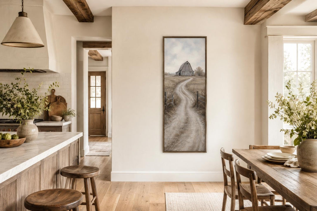 Tall narrow farmhouse wall art of a weathered barn and winding road in a rustic kitchen setting.
