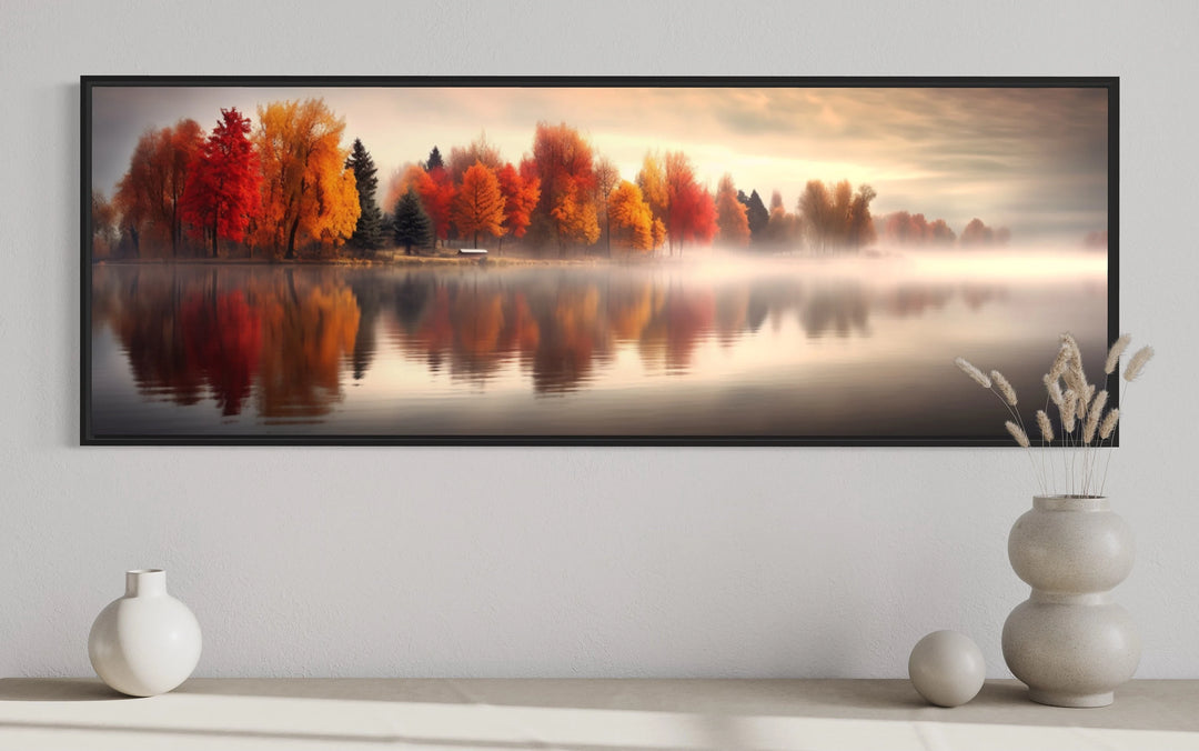 a picture of a lake surrounded by autumn trees