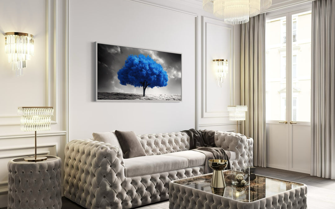 Blue Tree on Black White Background Framed Canvas Wall Art in living room with a couch and a coffee table