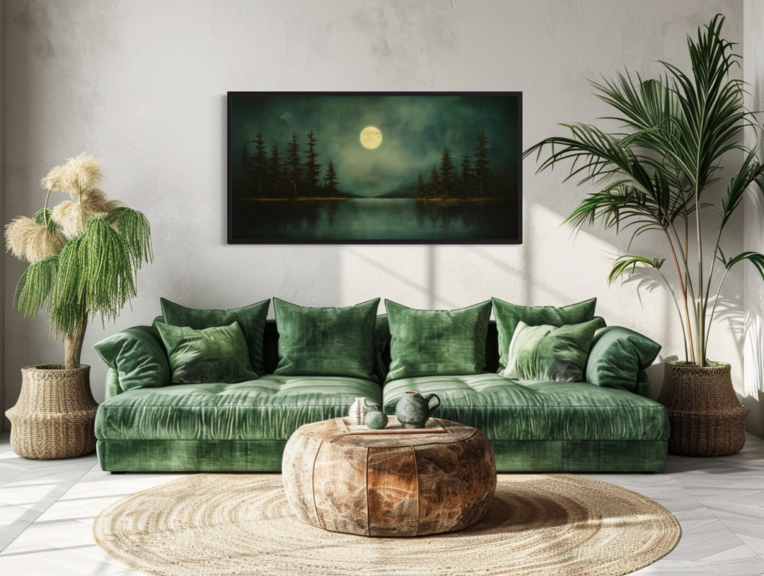 Emerald Green Lake, Forest Moon Vintage Framed Canvas Wall Art in a living room with a green couch and potted plants