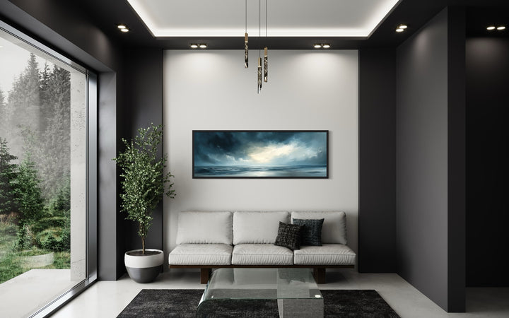 Stormy Horizon Over The Ocean Panoramic Canvas Wall Art in a living room with a couch