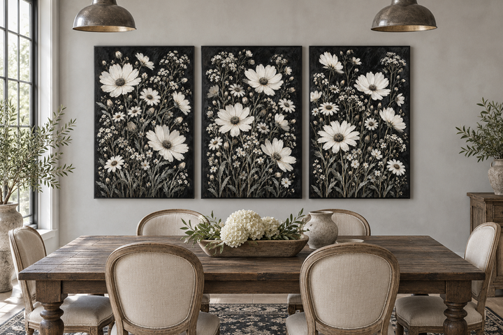 Set of 3 white wildflower canvas prints on black backgrounds in a rustic farmhouse dining room.