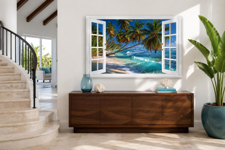 Window view canvas art of a tropical beach with palm trees and turquoise water on a white wall.