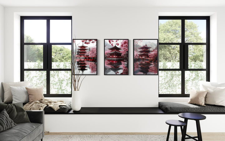 Set Of Three Japanese Pagoda and Cherry Blossom Wall Art in a living room with a couch and a window