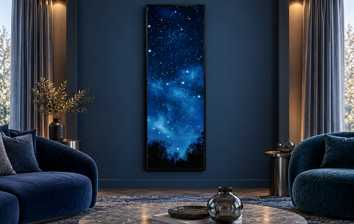 Tall narrow vertical framed canvas wall art featuring a starry navy blue Milky Way night sky.