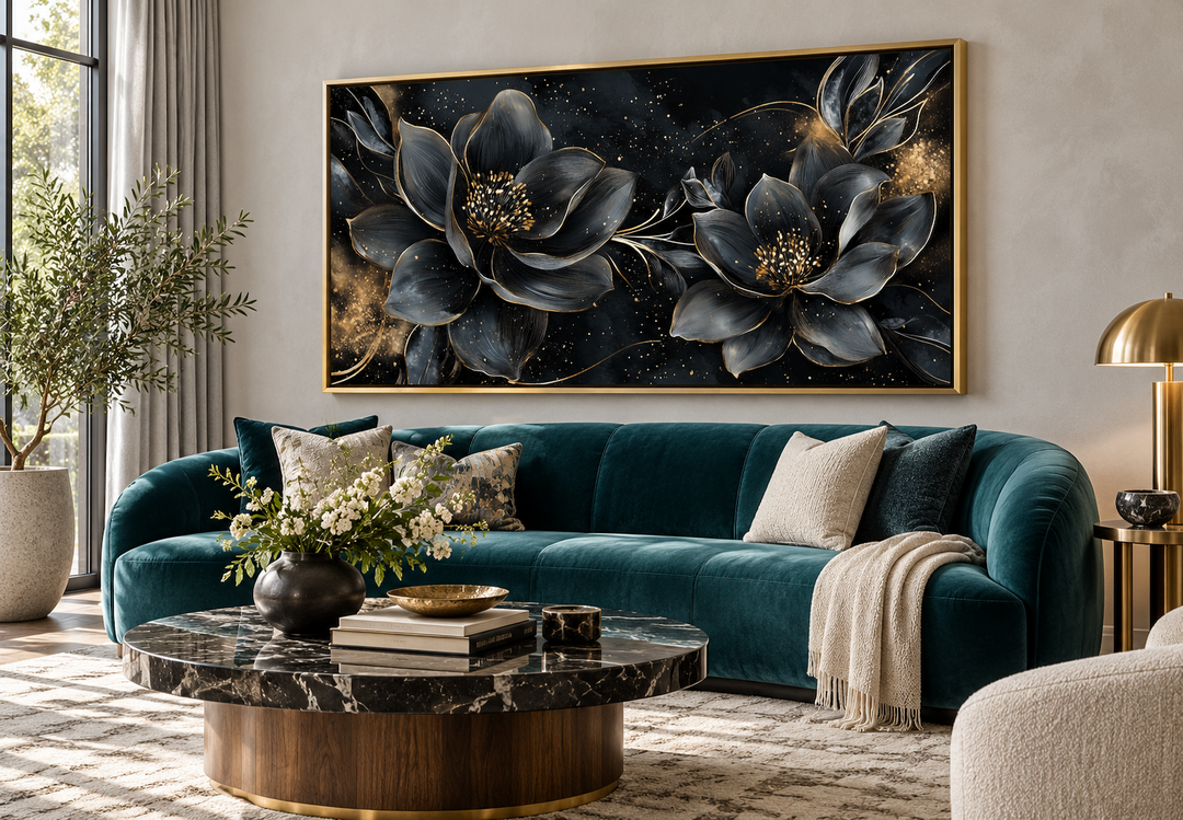 Black gold floral Art Nouveau framed canvas wall art hanging above a teal velvet sofa.