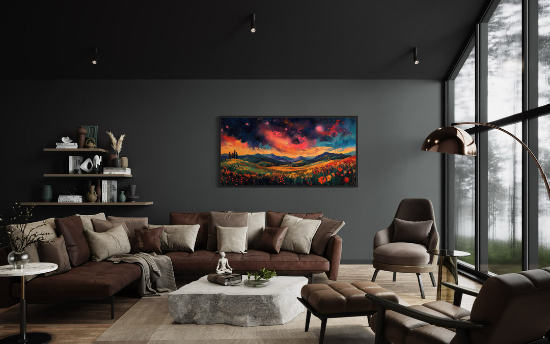 Starry Night Sky Over Wildflower Fields and Mountains Framed Canvas Wall Art in a living room filled with furniture