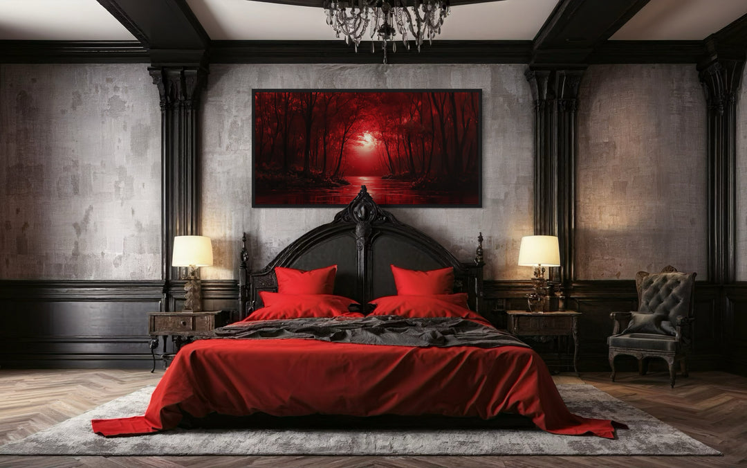 Red Forest And Moon Landscape Framed Canvas Wall Art in a bedroom with a large bed and a chandelier