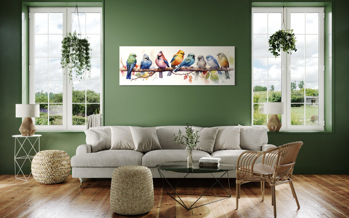 Colorful Birds On A Branch Horizontal Framed Canvas Wall Art in a living room filled with furniture