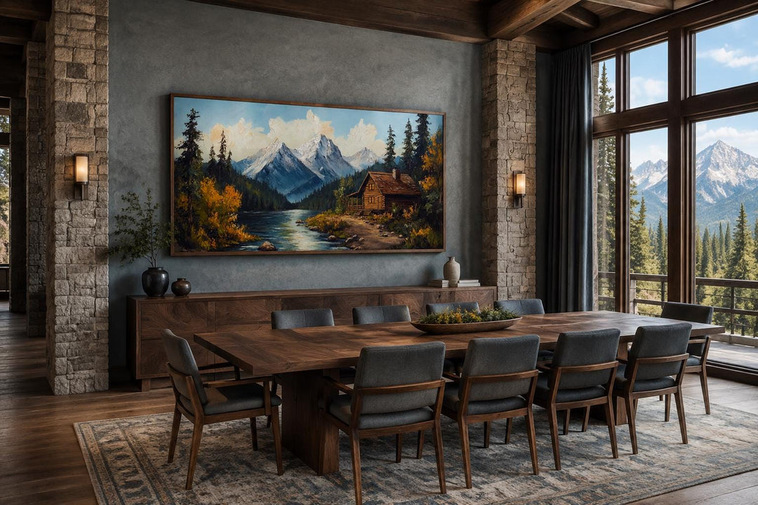 Mountain cabin on the river nature vintage style canvas wall art in a rustic dining room.