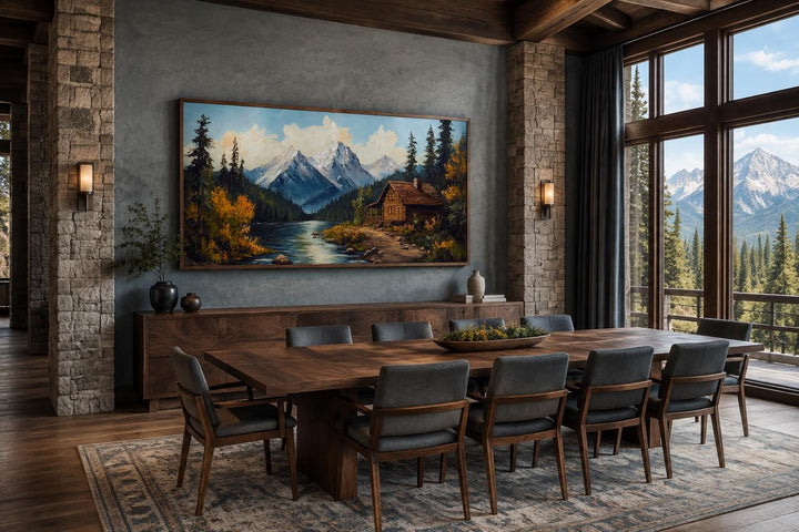 Mountain cabin on the river nature vintage style canvas wall art in a rustic dining room.