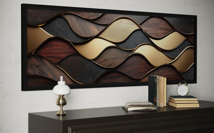 Long horizontal canvas art with abstract brown and gold wood-grain waves in a black frame.