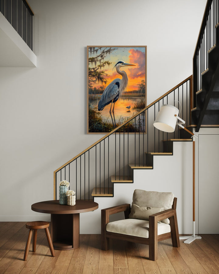 Blue Heron at Sunset Marshland Framed Canvas Wall Art next to a stair case