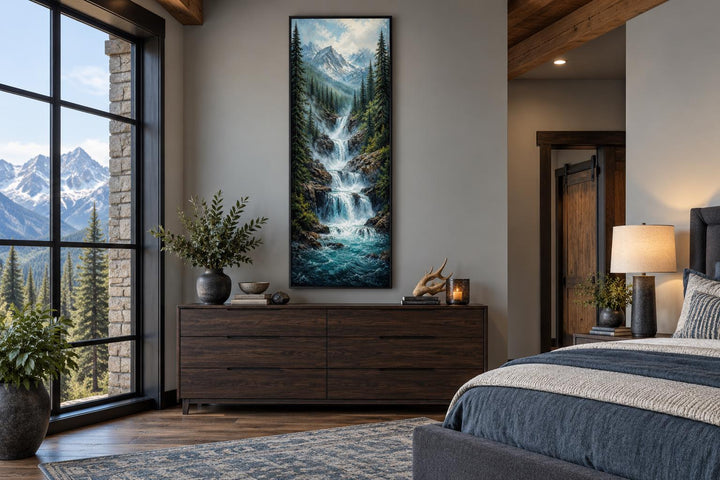 Tall narrow canvas wall art of a cascading mountain waterfall through a pine forest.