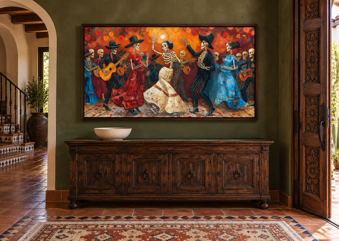 Dia De Los Muertos canvas art of dancing skeletons in a walnut frame above a wooden sideboard.