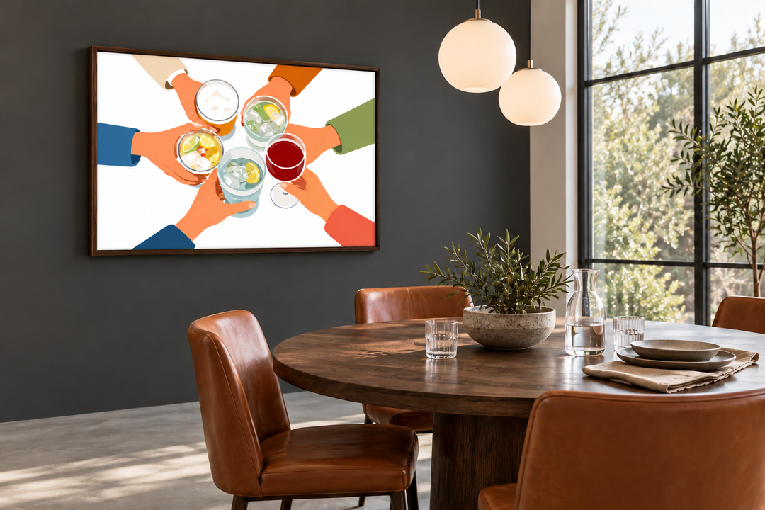 Cheers wall art canvas print showing friends toasting drinks in a modern dining room setting.