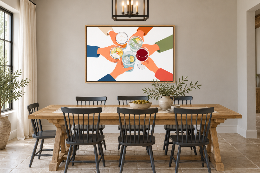 Modern Cheers wall art canvas print of friends toasting drinks above a wooden dining table.