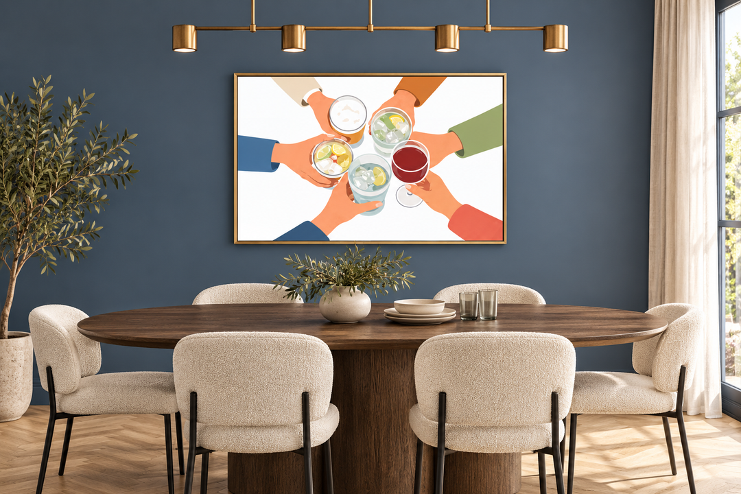 Modern dining room wall art canvas print of friends toasting drinks in a gold frame on a blue wall.