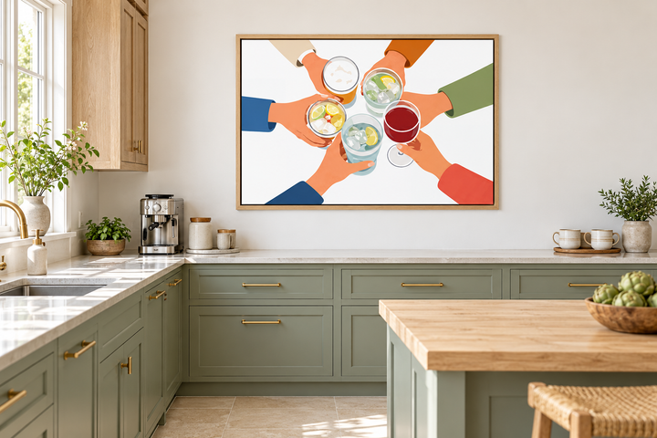 Modern canvas print of friends toasting drinks in a sage green kitchen with oak cabinets.
