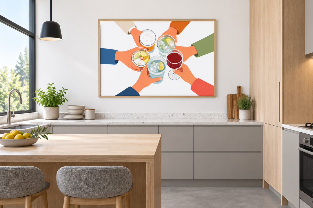 Modern Cheers wall art canvas print of friends toasting drinks in a light oak frame in a kitchen.