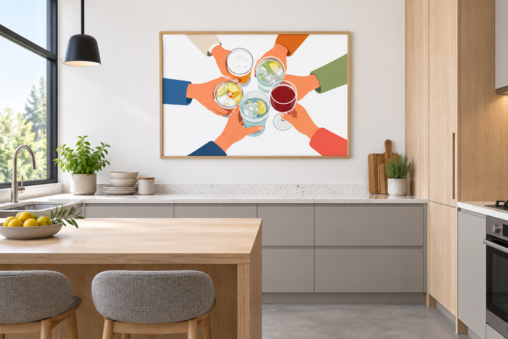 Modern Cheers wall art canvas print of friends toasting drinks in a light oak frame in a kitchen.