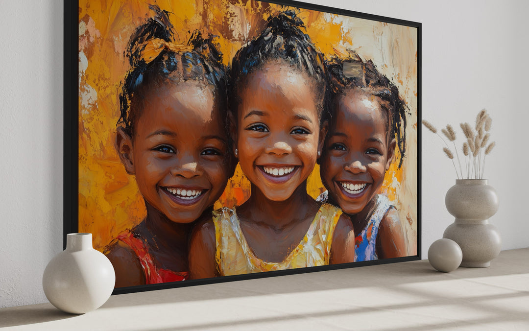 a painting of three little black girls smiling