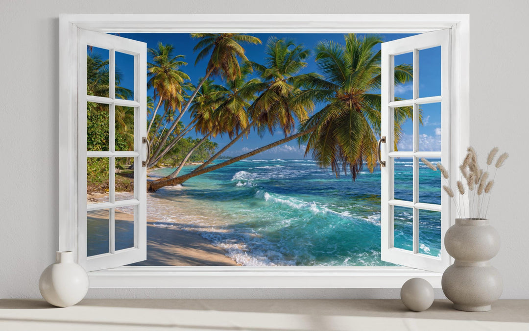 Window view canvas wall art of a tropical beach with palm trees and turquoise ocean waves.