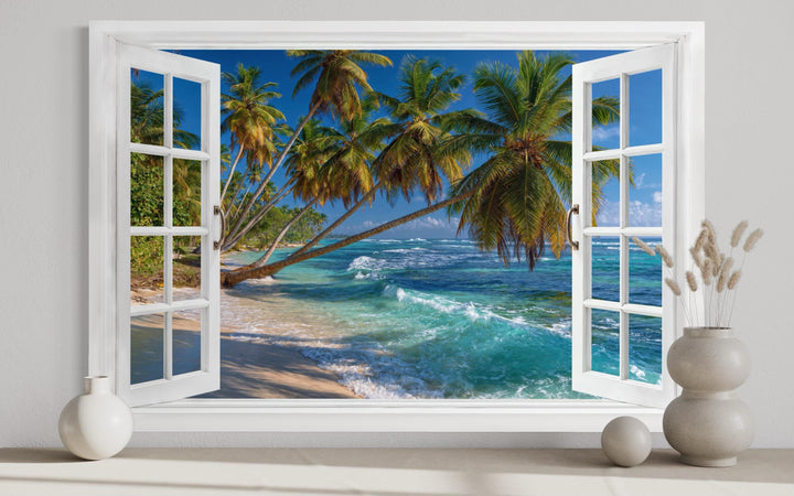 Window view canvas wall art of a tropical beach with palm trees and turquoise ocean waves.