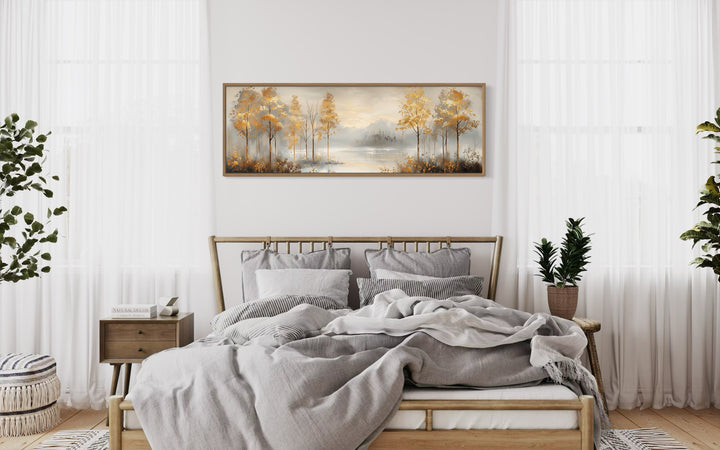 Golden Autumn Forest Panoramic Canvas Wall Art above wooden bed