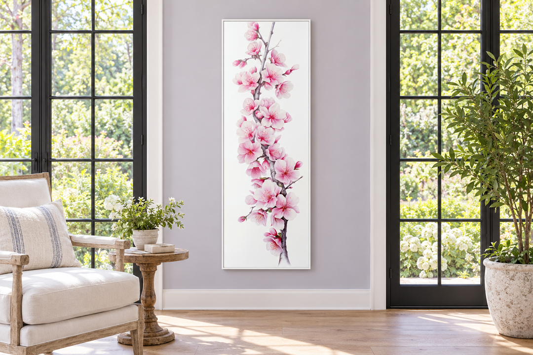 Vertical framed canvas wall art featuring pink watercolor cherry blossoms on a white background.