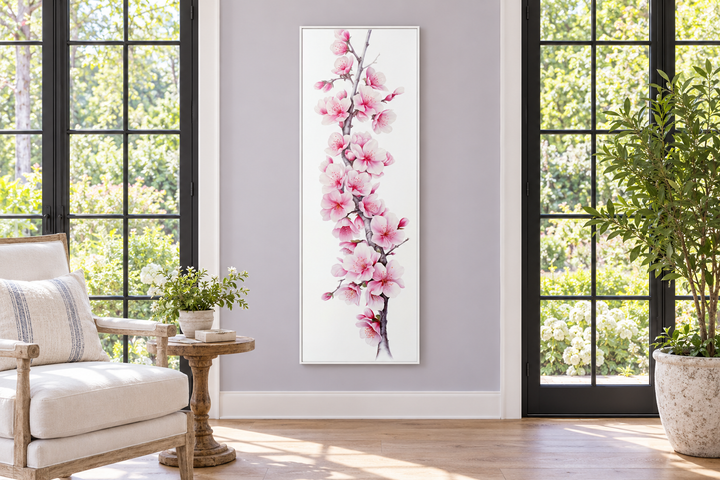 Vertical framed canvas wall art featuring pink watercolor cherry blossoms on a white background.