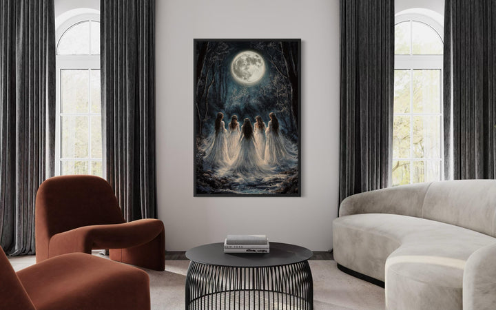 Vertical canvas print of gothic witches in a moonlit forest hanging in a modern living room.