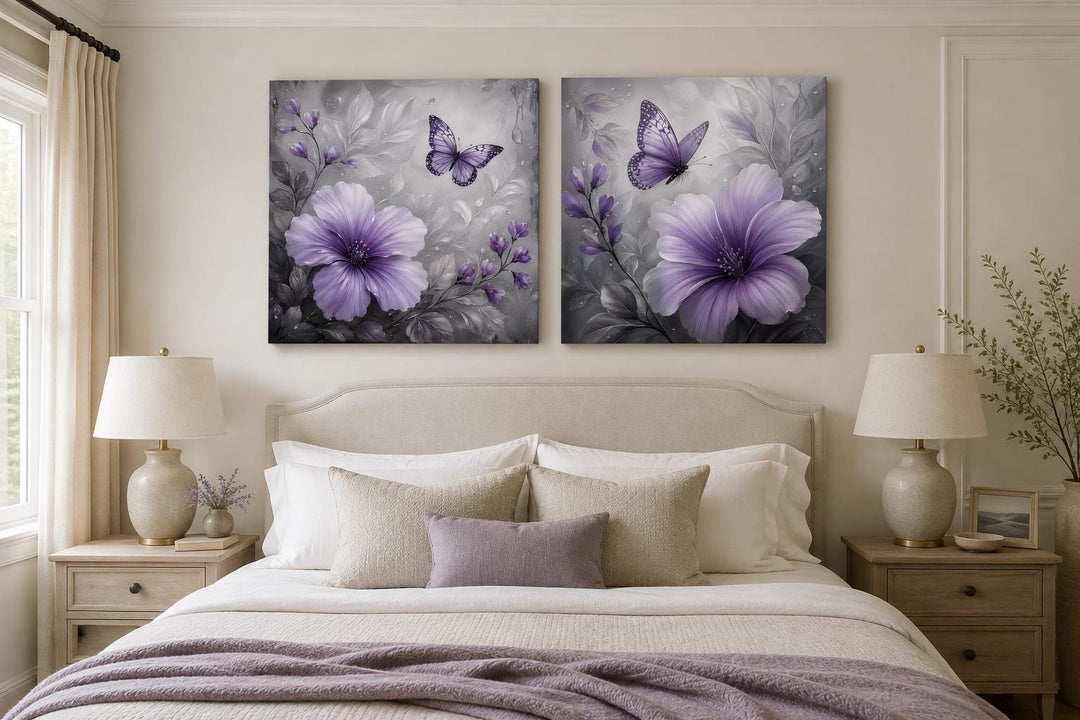 Set of 2 purple hibiscus and butterfly canvas prints on a gray floral background above a bed.