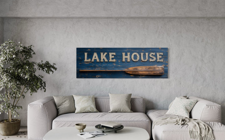 Lake House Sign With Oar Long Horizontal Framed Canvas Wall Art in a living room with a couch and a table