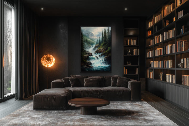 Vertical canvas wall art of a cascading mountain waterfall and pine forest in a dark modern room.