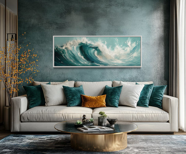 Teal Ocean Wave Coastal Horizontal Framed Canvas Wall Art in a living room filled with furniture and a painting on the wall