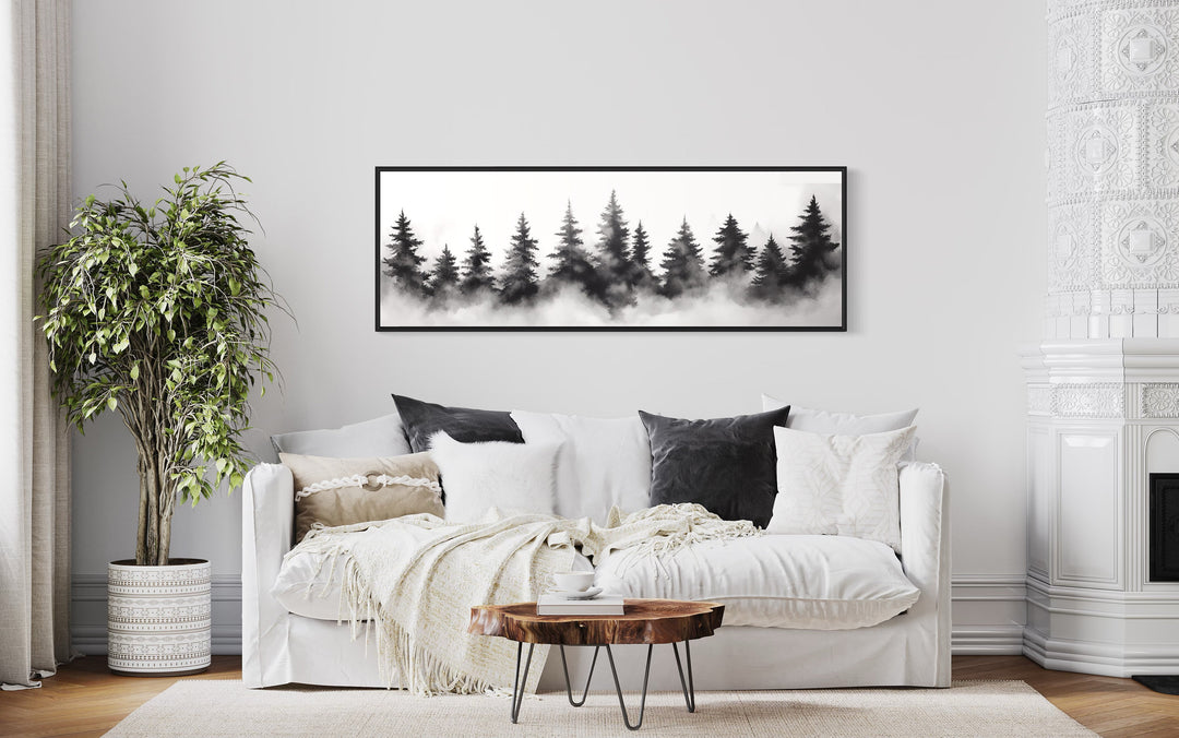 Black And White Watercolor Foggy Pine Tree Forest Horizontal Canvas Wall Art above white couch