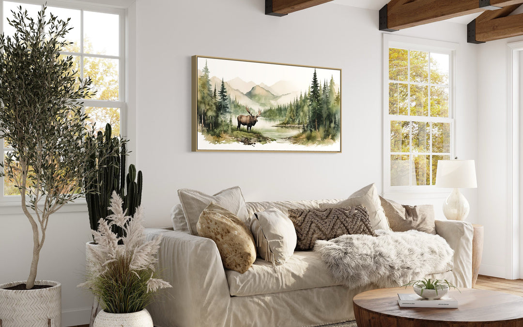 Moose In The Wilderness Mountain Landscape Framed Canvas Wall Art above beige couch