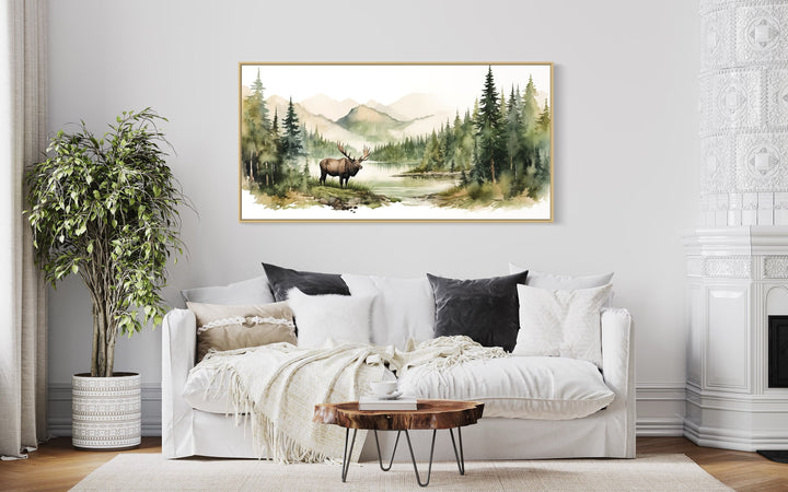 Moose In The Wilderness Mountain Landscape Framed Canvas Wall Art above white bed