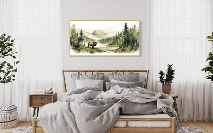 Moose In The Wilderness Mountain Landscape Framed Canvas Wall Art above wooden bed