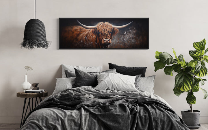 Dark Highland Cow In Grass Long Horizontal Canvas Wall Art above bed