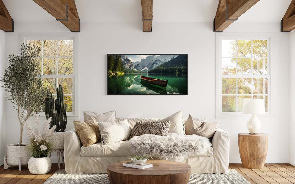 Wooden Canoe In Emerald Green Lake Wall Art "Mountain Lake Solitude" over beige couch