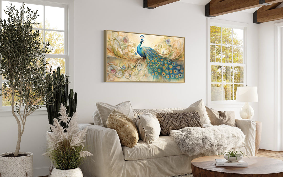 Gold Green Peacock Framed Canvas Wall Art above beige couch