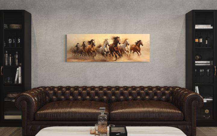 Herd of Wild Horses Running Panoramic Wall Art above brown couch