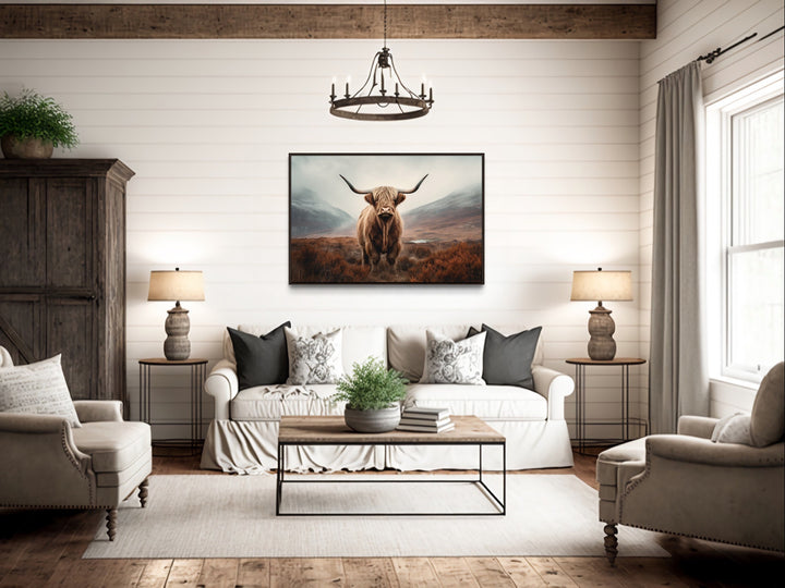 Muted Colors Highland Cow Framed Canvas Wall Art above rustic couch