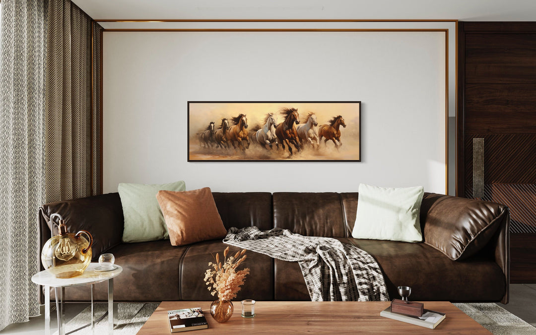 Herd of Wild Horses Running Panoramic Wall Art above brown couch