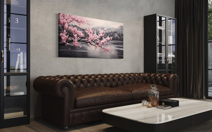 Pink Cherry Blossom on Black Abstract Framed Canvas Wall Art above brown couch